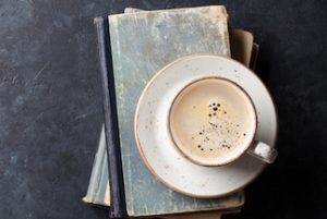 Coffee cup over books