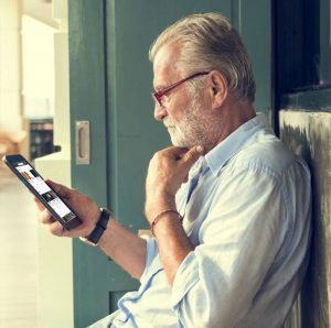 Man looking at ChangeLeaders Community screen