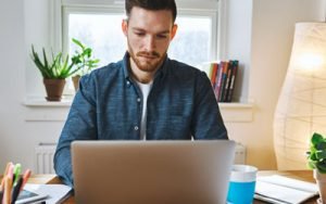 Man reading Modern Learners newsletter