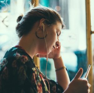 Woman listening to Modern Learners podcast
