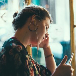 Woman listening to Modern Learners podcast
